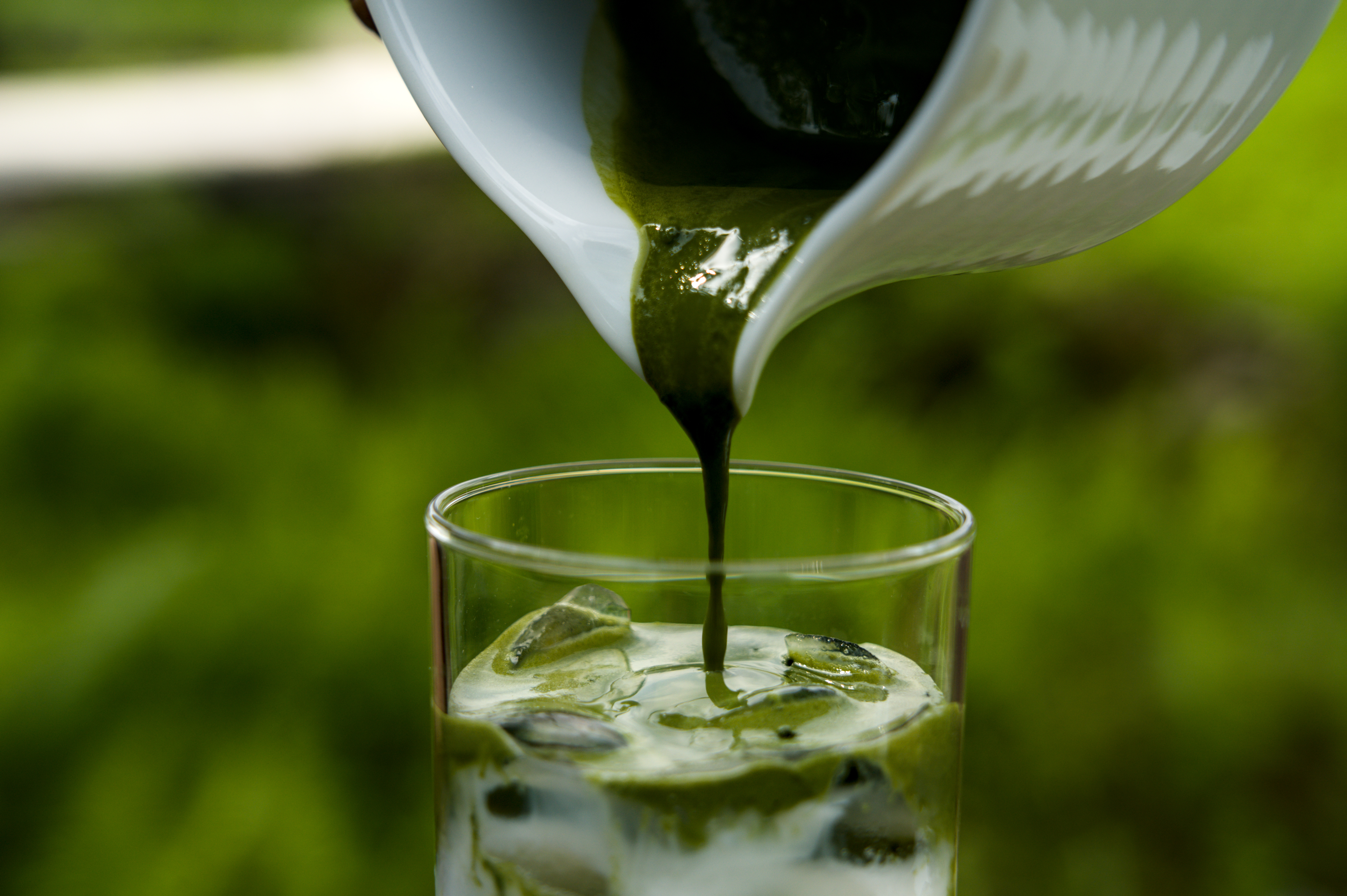 BRASS Matcha being poured over ice